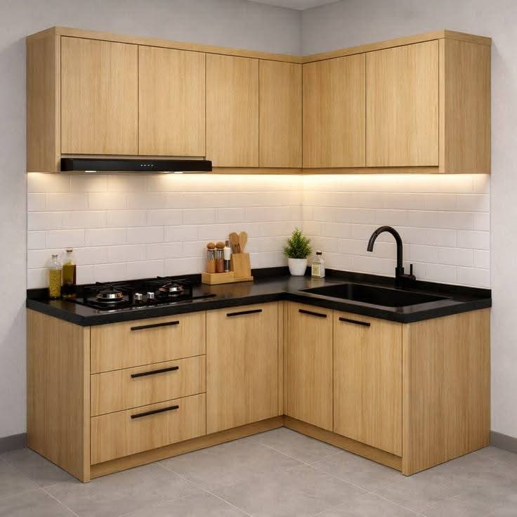 Dapur modern berbentuk L dengan kabinet kayu, meja hitam, dan lampu LED di bawah kabinet.